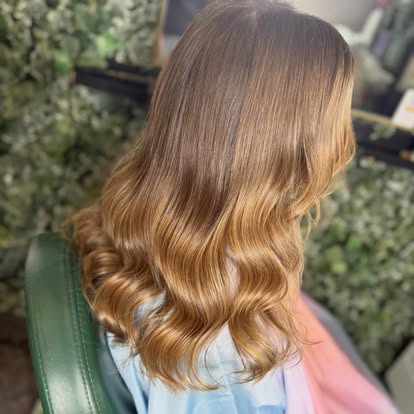 Chestnut balayage hair colour styled in soft waves