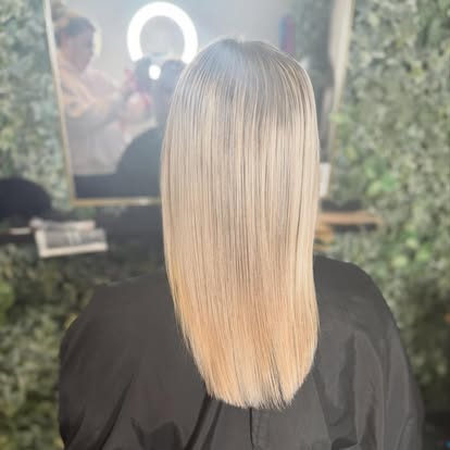Platinum blonde hair colour finished poker straight and glossy